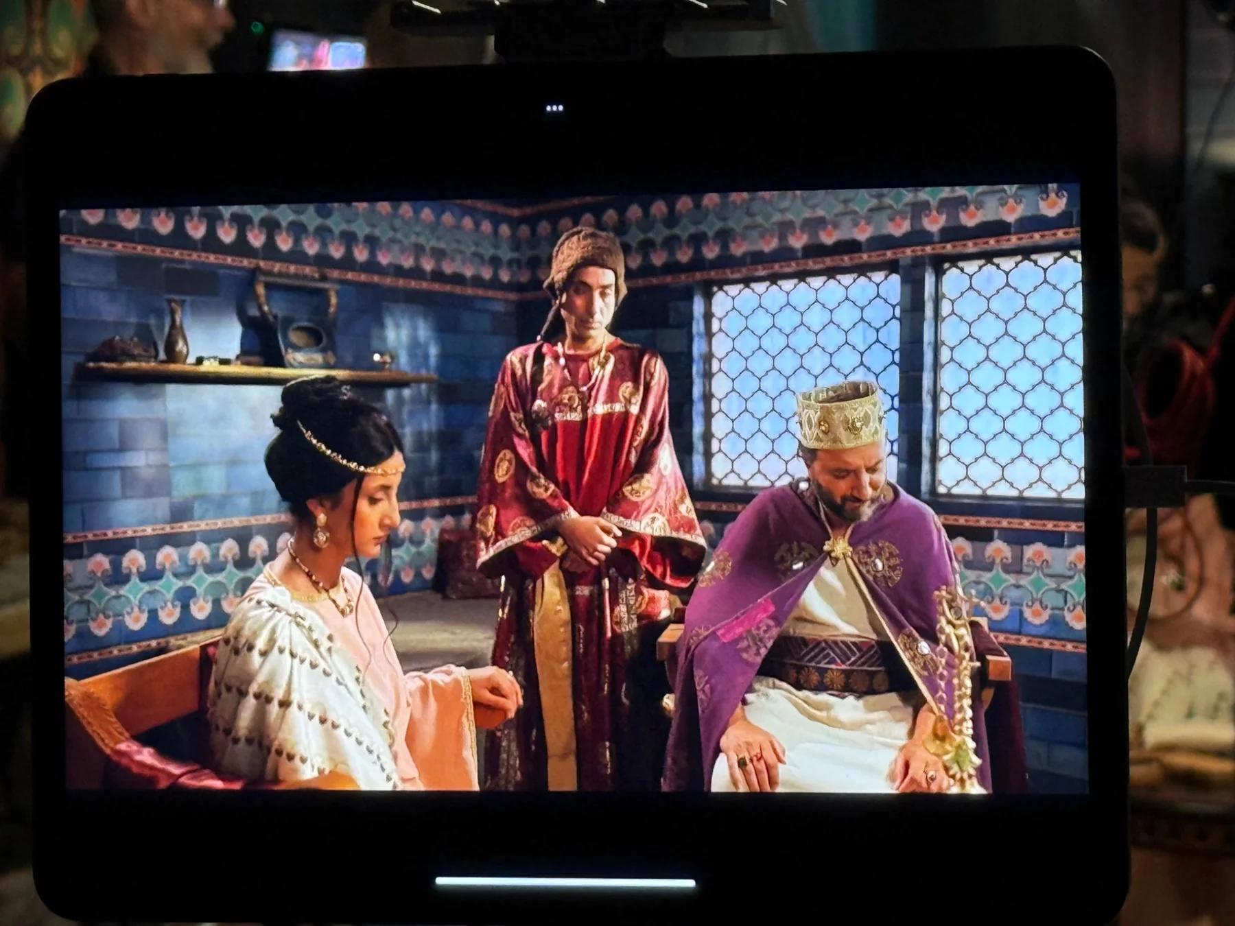 Period film scene on a production monitor