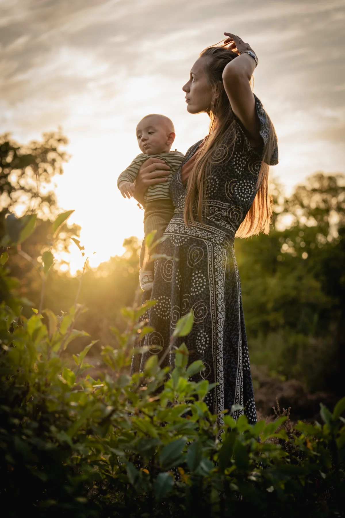 Parent and child at sunset