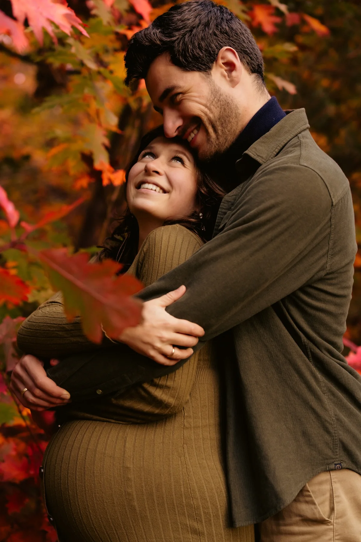 Couple in an autumn maternity portrait